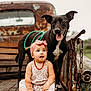 Josie joined the competition — help win amazing prizes! baby, dog, animal, pet, child, outdoor, rustic, truck, wooden, leash, headband, floral_outfit, smiling_dog, sitting, cute, playful, nature, vintage, rust, chain