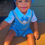 River joined the competition — help win amazing prizes! toddler, child, smiling, blue_outfit, hat, sandals, sunlight, wooden_deck, happy, cute, portrait, baby, outdoor, sitting, footwear, person, summer, playful, bright, casual