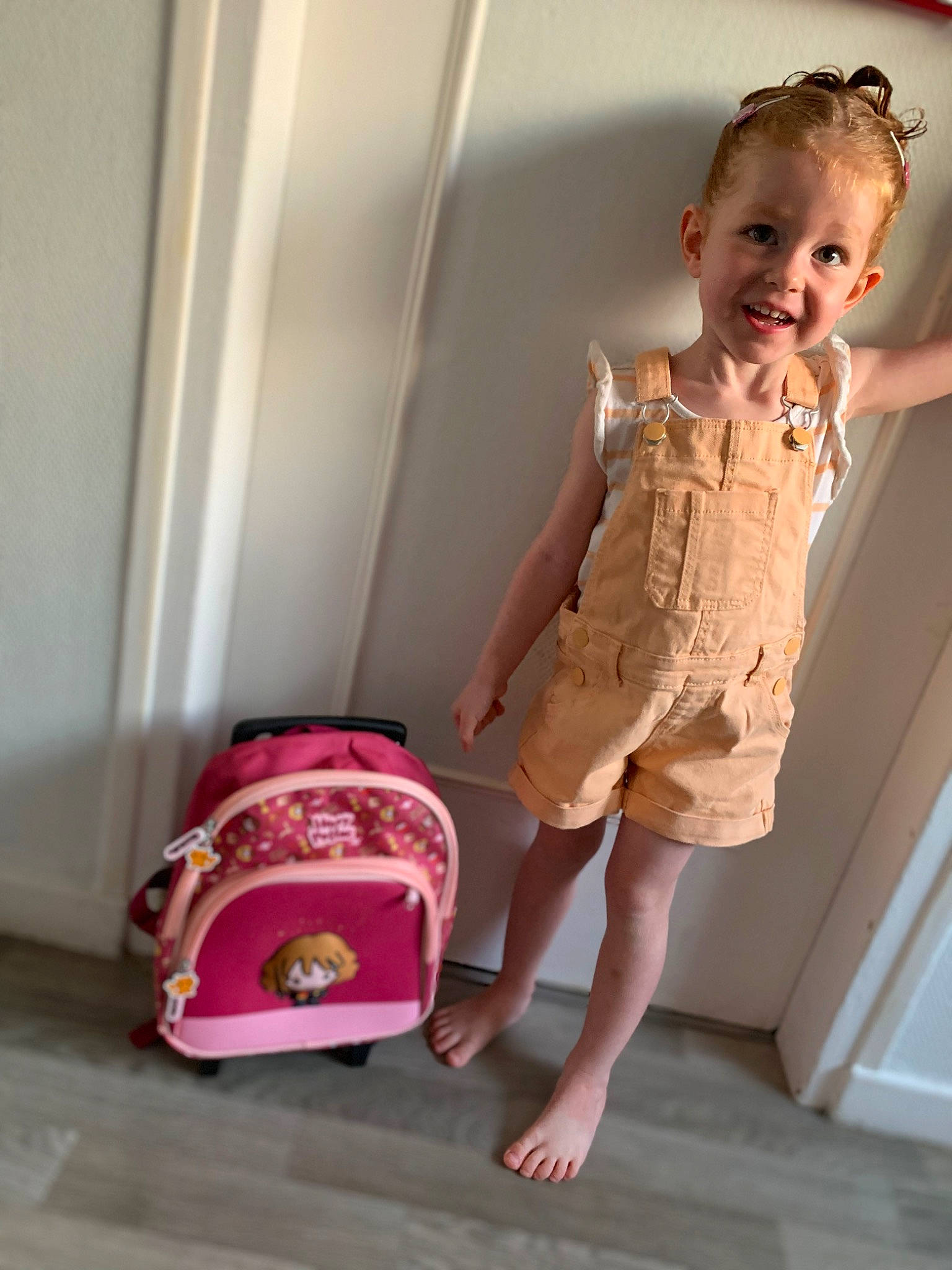 Lyna participe au concours pour gagner de l'argent avec cette photo : baby_toddler_clothing, child, day_dress, flooring, happy, human_leg, joint, joy, knee, magenta, one_piece_garment, pattern, person, pink, shorts, sitting, skin, sleeve, smile, thigh
