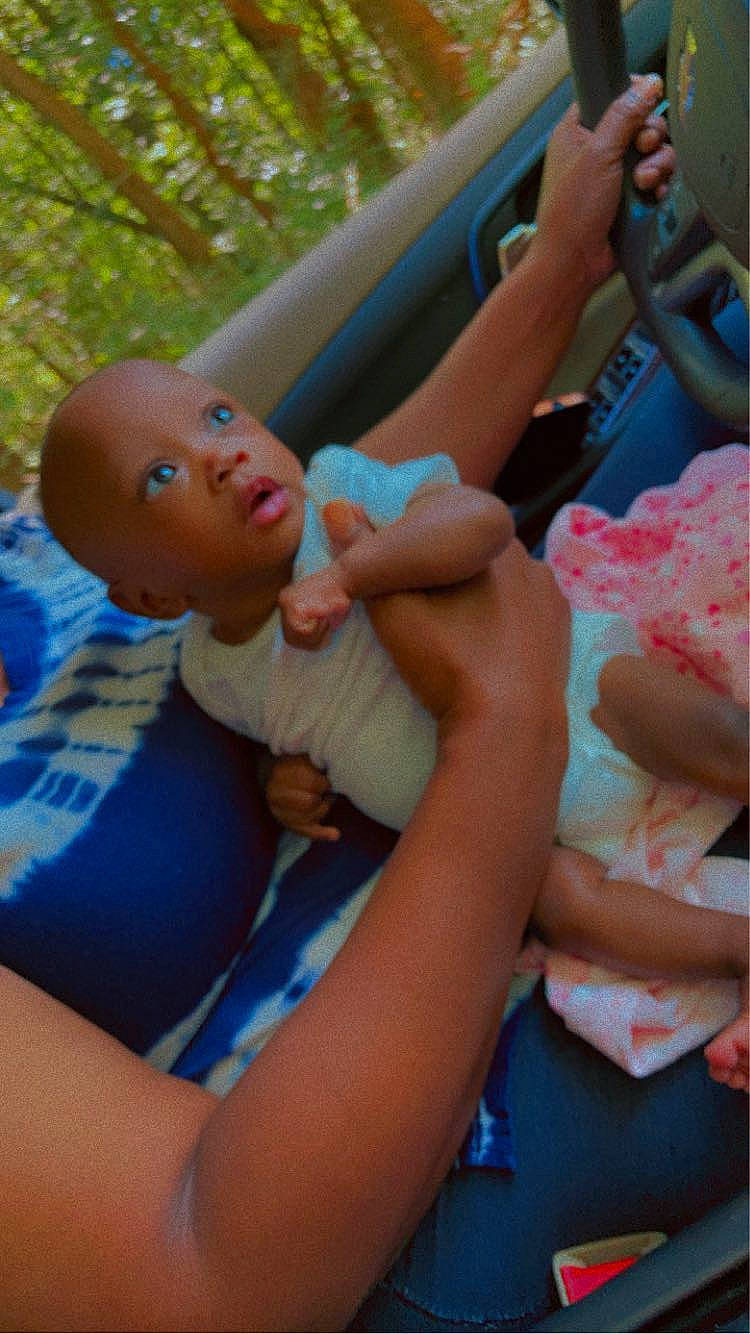 Kensely joined the competition — help win amazing prizes! baby, child, comfort, event, finger, fun, gesture, grass, hand, happy, lap, leisure, mouth, person, recreation, sitting, skin, thigh, thumb, toddler