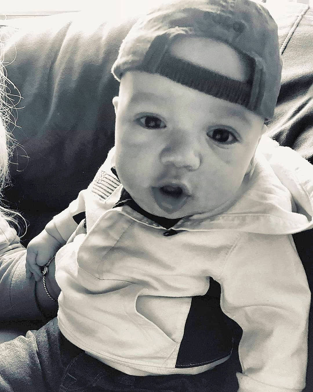 Raul is registered to the contest to win money with this photo: black, black_and_white, cheek, child, cool, eye, forehead, girl, headgear, headwear, human, infant, monochrome, monochrome_photography, person, photography, portrait, portrait_photography, product, smile