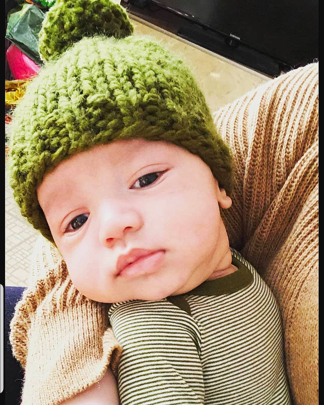 Raul is registered to the contest to win money with this photo: beanie, bonnet, cap, cheek, child, crochet, eye, fur, hat, headgear, headwear, infant, knit_cap, knitting, nose, person, smile, textile, toddler, wool