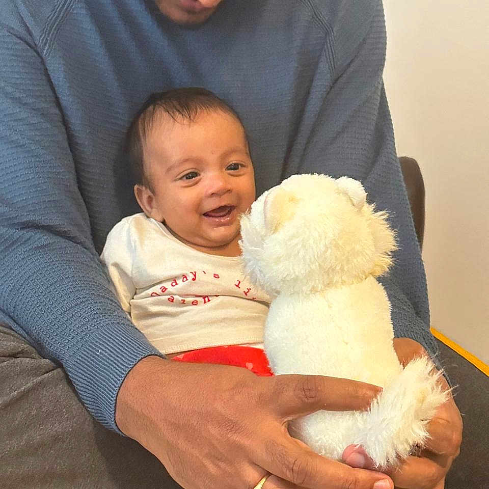Thiyansh Jaswik is registered to the contest to win money with this photo: adult, baby, blanket, bonding, casual, clothing, comfort, cuddle, face, family, hands, happy, indoor, love, person, sitting, smile, stuffed_animal, toy, warmth