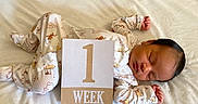 Iverson joined the competition — help win amazing prizes! animal_print, baby, blanket, child, cozy, cute, early_life, indoors, infant, lying_down, milestone_card, newborn, one_week, pajamas, peaceful, portrait, sleep, sleeping, small_hands, soft_lighting
