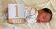 Iverson joined the competition — help win amazing prizes! newborn, baby, sleeping, milestone_card, onesie, animal_print, blanket, infant, peaceful, cute, soft, portrait, side_view, resting, child, one_week, bedroom, young, tiny, sleep