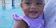 Ivory is registered to the contest to win money with this photo: baby, child, cute, daylight, fountain, happy, holding, outdoor, park, people, person, play, purple_clothing, smiling, splash_pad, summer, toddler, water, water_park, wet_hair