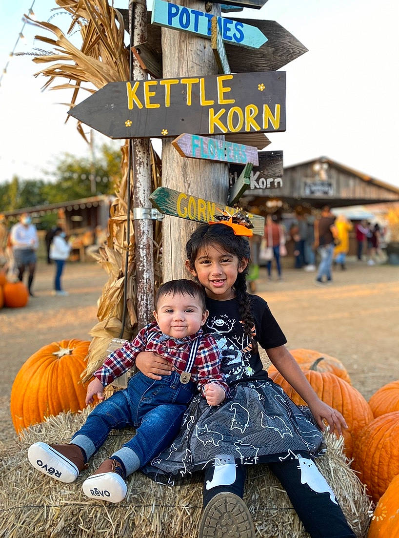 Arielle joined the competition — help win amazing prizes! calabaza, community, fun, happy, human, joy, leisure, mammal, people_in_nature, person, photograph, public_space, pumpkin, recreation, sky, snapshot, toddler, travel, tree, vertebrate