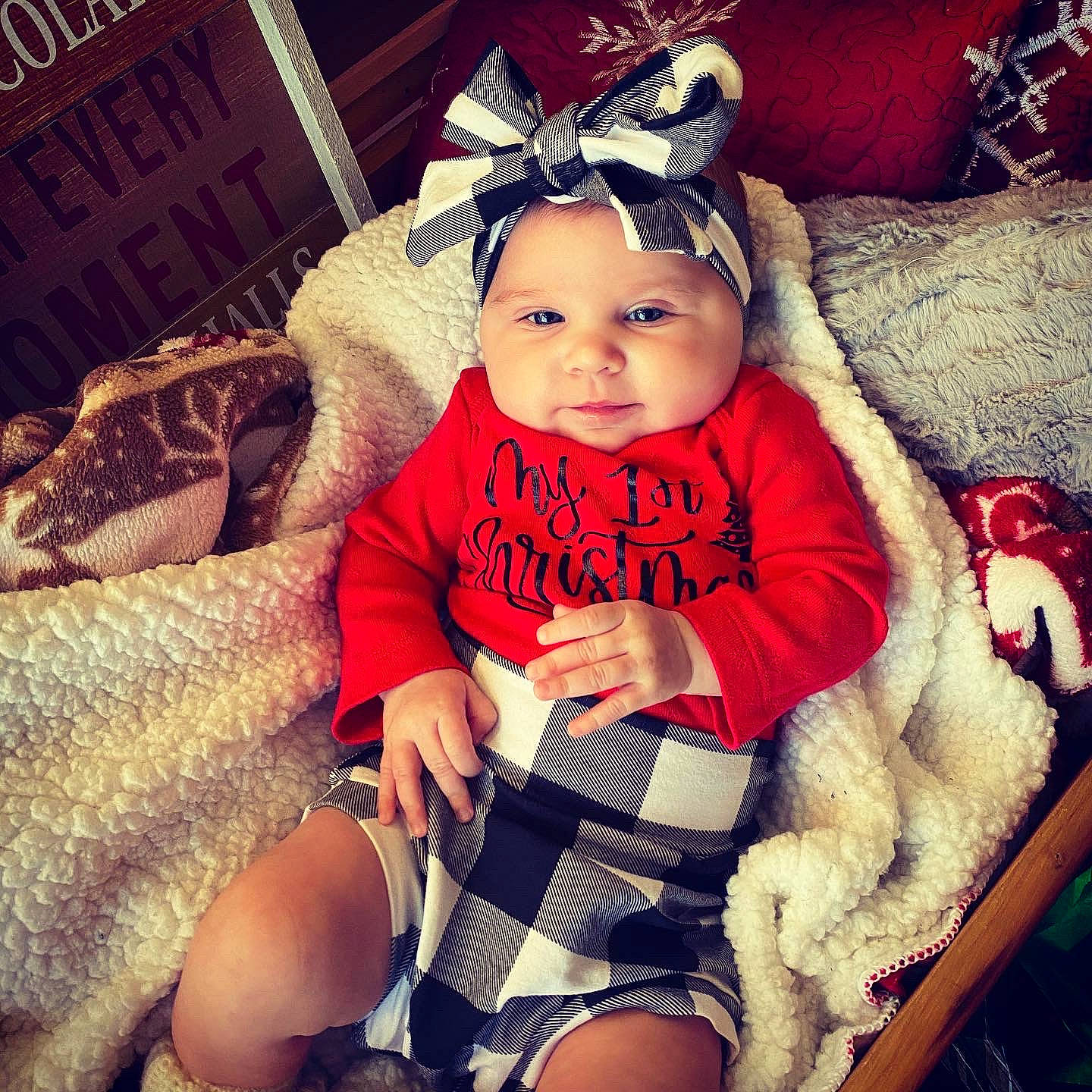 Laney is registered to the contest to win money with this photo: baby, baby_products, baby_safety, baby_sleeping, baby_toddler_clothing, child, comfort, costume_accessory, fur, hair_accessory, headband, headpiece, headwear, lap, nail, person, product, sitting, sock, thigh