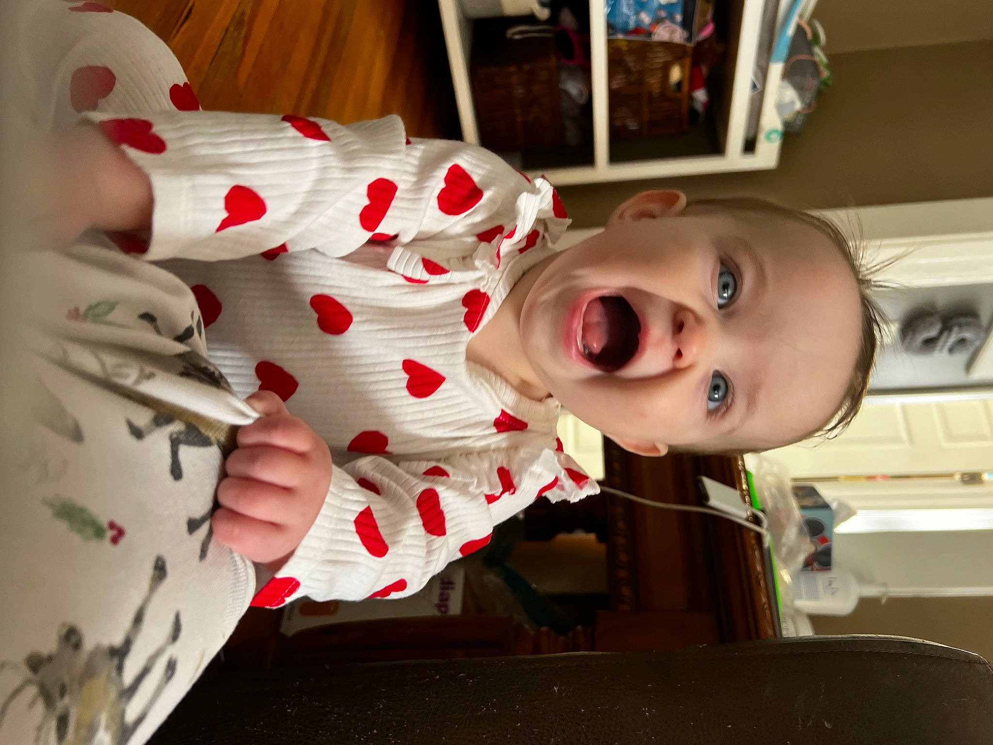Amelia is registered to the contest to win money with this photo: baby, baby_toddler_clothing, carmine, cheek, child, eye, face, fun, happy, head, mammal, mouth, nose, pattern, person, skin, sleeve, smile, textile, toddler