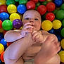 River is registered to the contest to win money with this photo: arm, baby, balloon, biting, bodypart, diaper, face, finger, hand, happy, head, indoors, newborn, person, photography, playarea, portrait, smile, sphere, toe