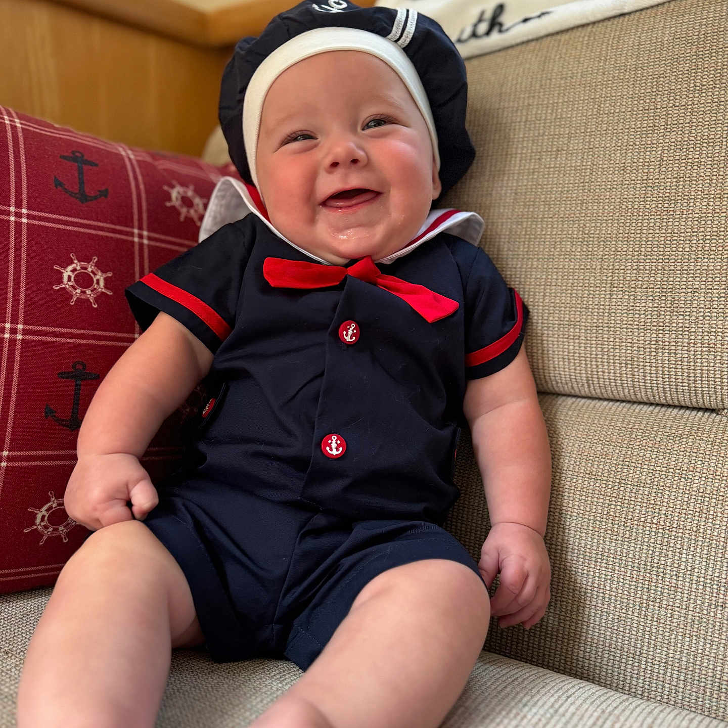 River joined the competition — help win amazing prizes! accessories, baby, babylaughing, bodypart, cap, clothing, couch, cushion, face, finger, formalwear, furniture, hand, happy, hat, head, person, photography, portrait, tie