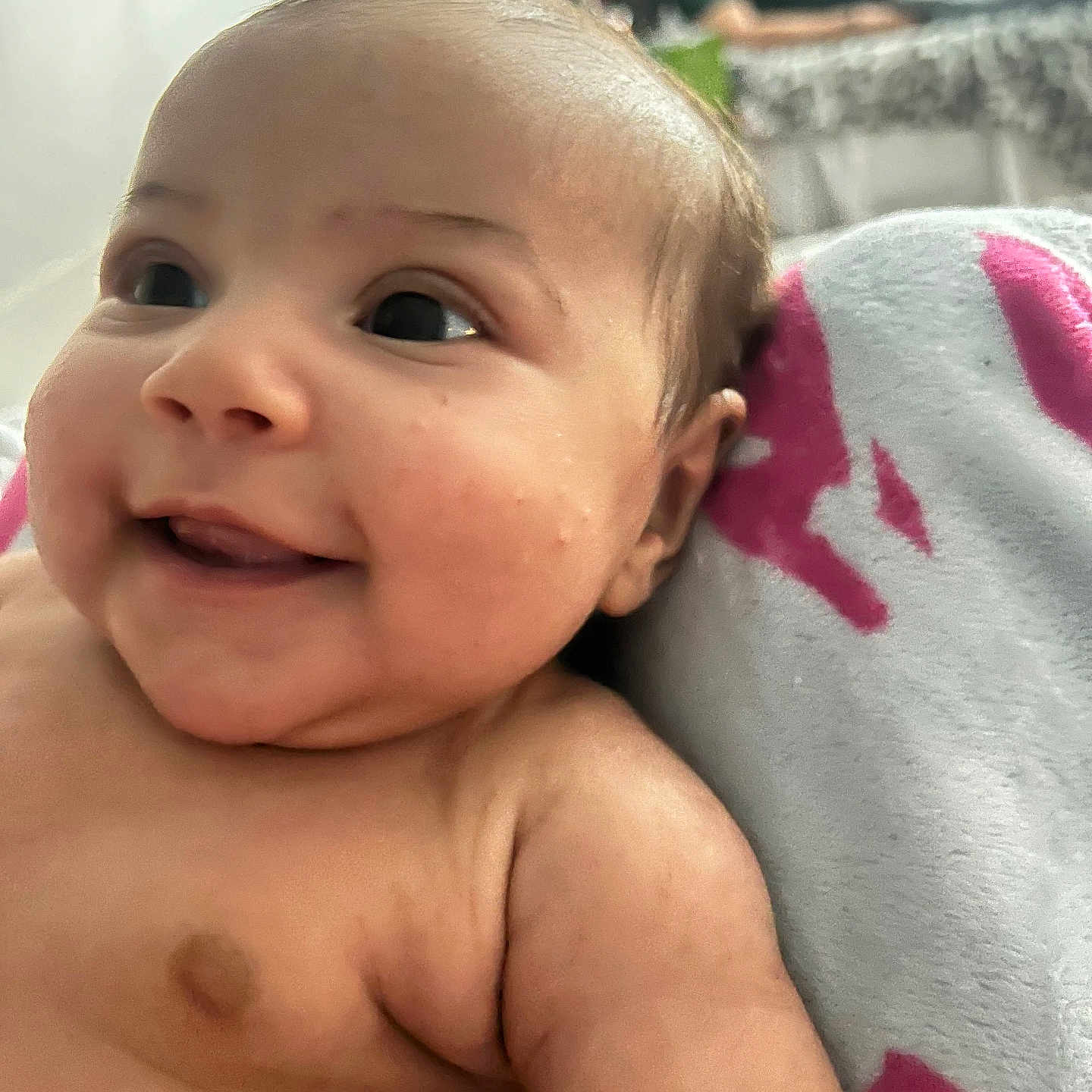 Iris joined the competition — help win amazing prizes! arm, baby, bed, blanket, blurred_background, cheek, closeup, comfort, cute, face, happy, indoors, infant, person, resting, skin, smile, soft_texture, warm, young_child