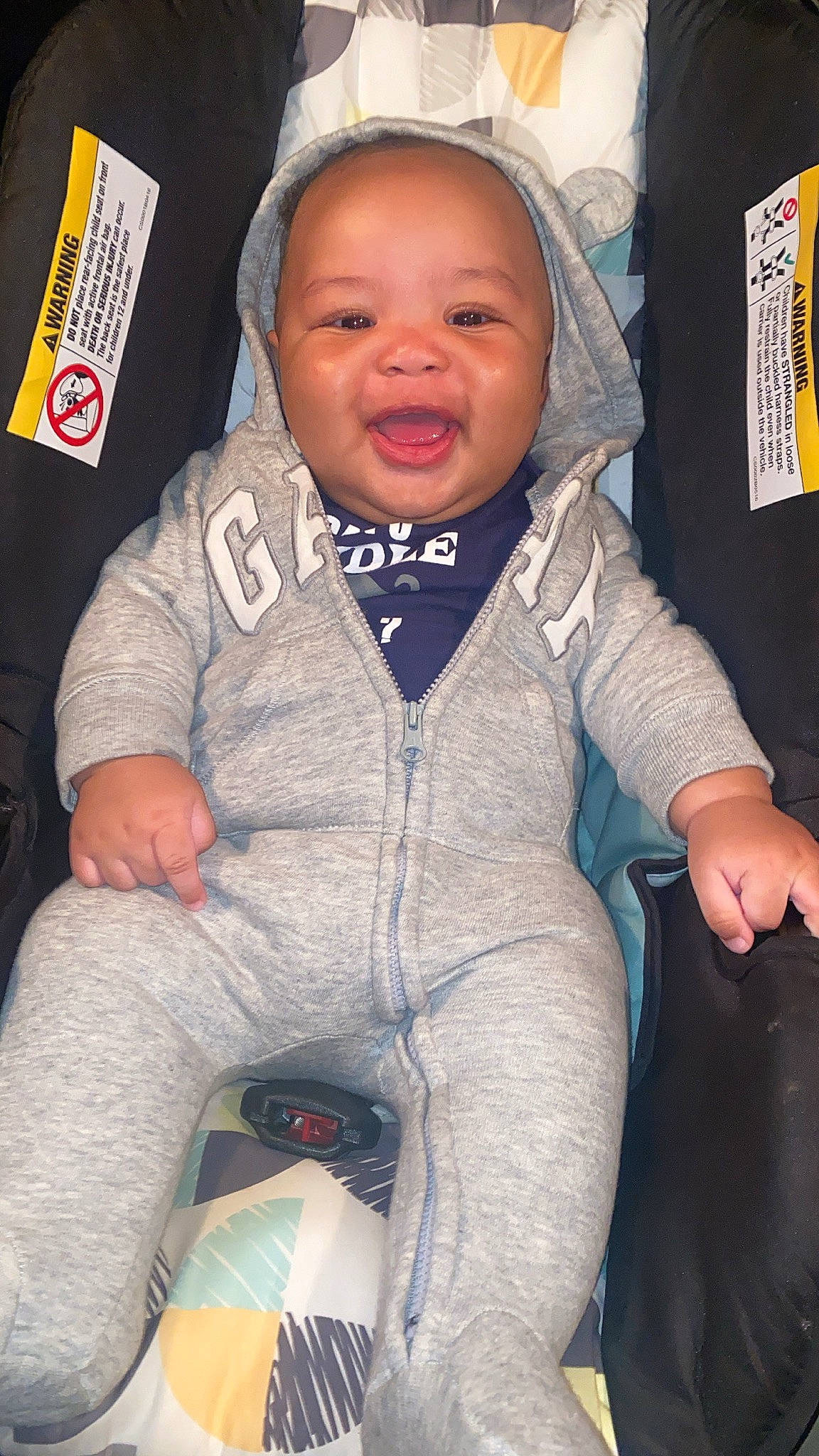 Carmelo is registered to the contest to win money with this photo: baby, baby_toddler_clothing, cheek, chin, comfort, cool, electric_blue, eye, finger, fun, gesture, happy, head, person, pink, skin, sleeve, smile, t_shirt, textile