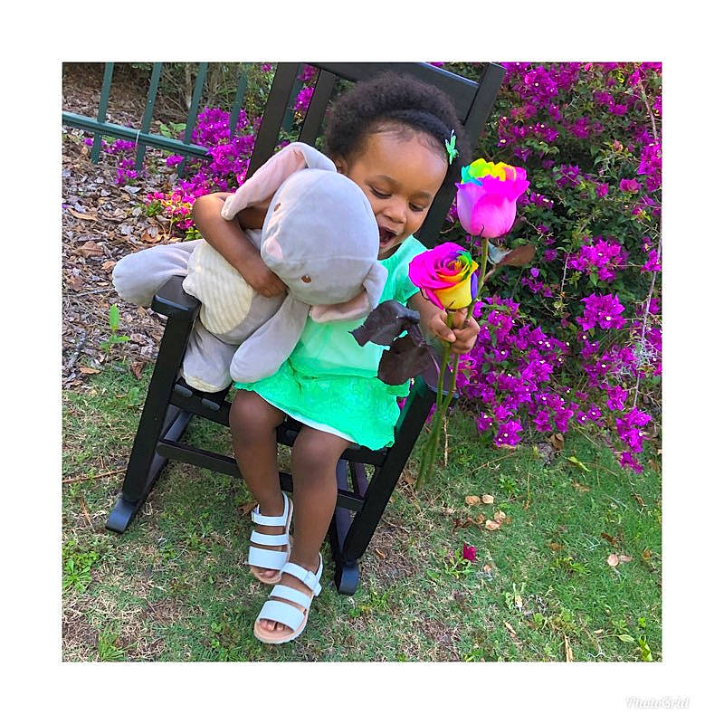 Zaylani joined the competition — help win amazing prizes! child, costume, flower, grass, happy, leg, love, person, petal, plant, play, purple, shoe, smile, spring, toddler, violet