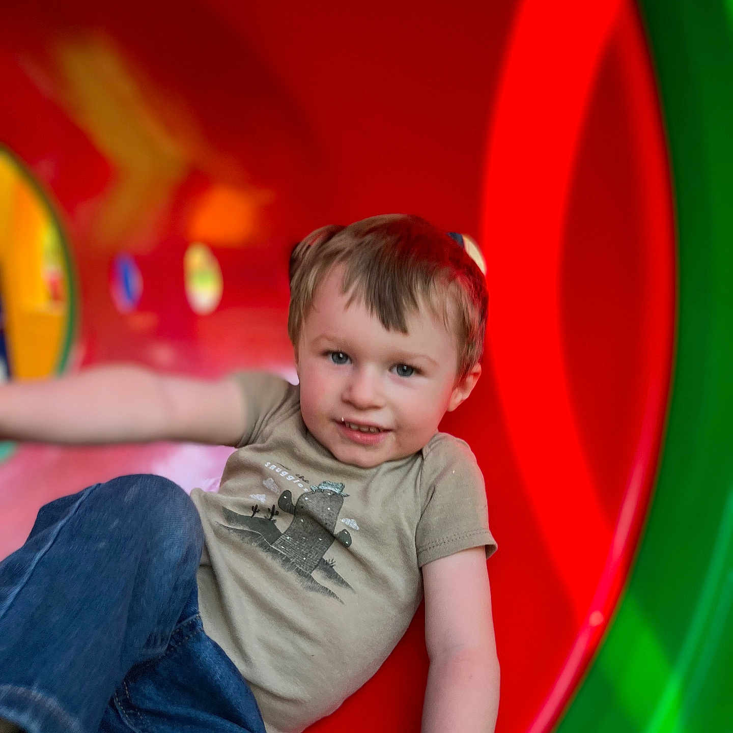 Daxton is registered to the contest to win money with this photo: bodypart, boy, child, clothing, face, finger, hand, head, indoors, jeans, male, outdoorplayarea, outdoors, pants, person, photography, playarea, portrait, slide, toy