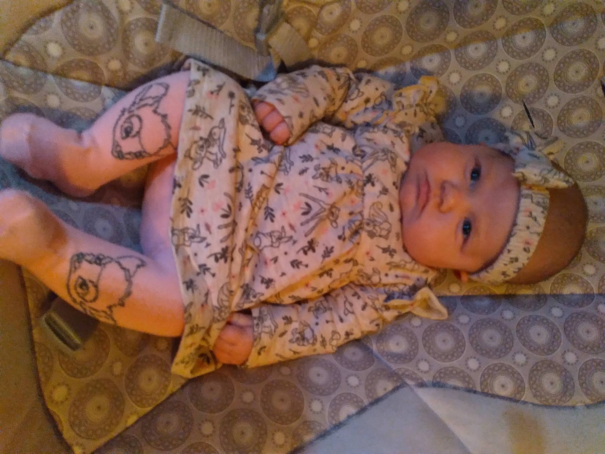 Rayla joined the competition — help win amazing prizes! arm, baby, baby_toddler_clothing, child, comfort, couch, flooring, head, headwear, human_body, human_leg, linens, mouth, pattern, person, skin, smile, temporary_tattoo, thigh, toddler