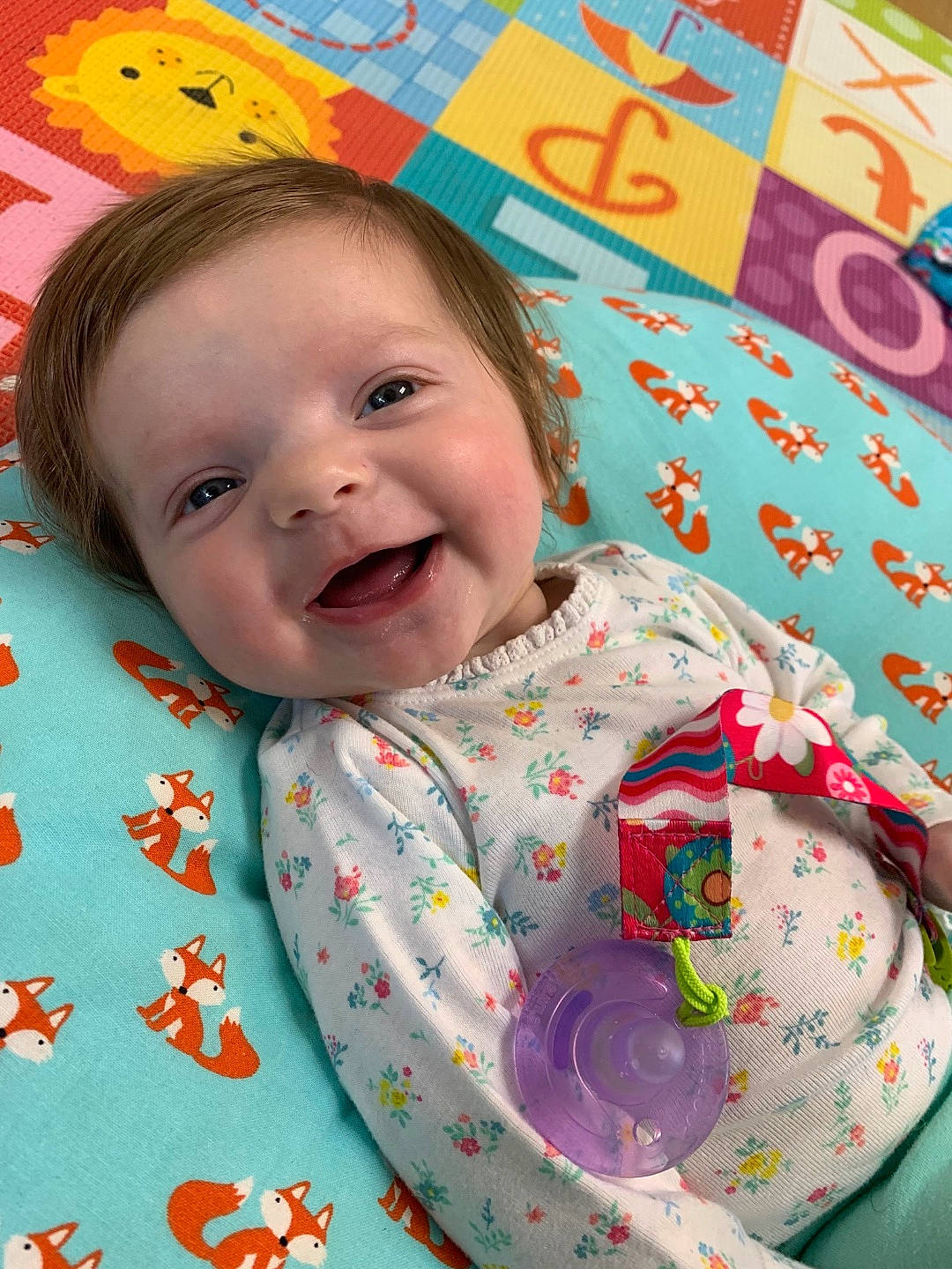 Maria joined the competition — help win amazing prizes! baby, bedding, cheek, child, face, happy, linens, lip, nap_mat, pattern, person, pink, play, skin, smile, textile, toddler