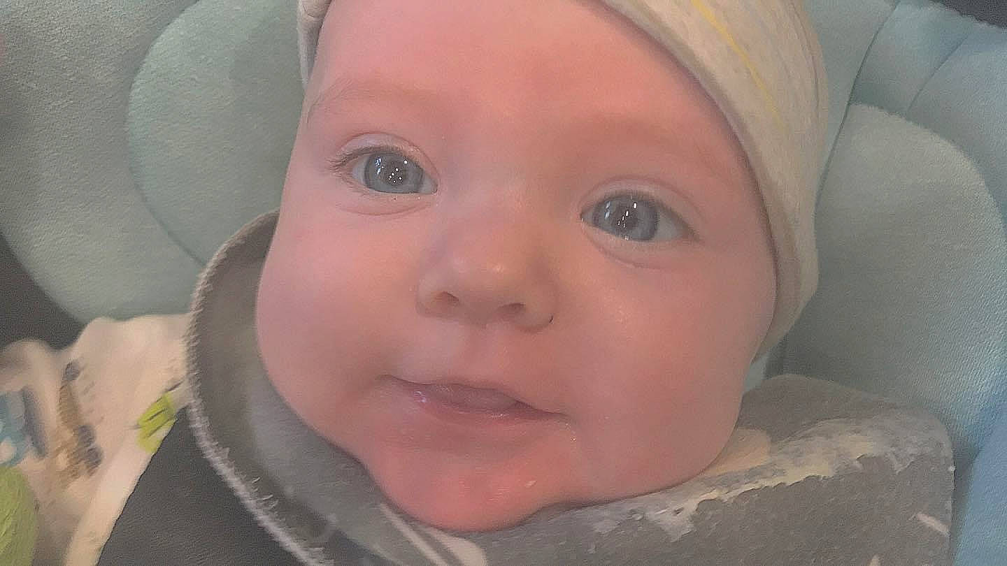 Gus is registered to the contest to win money with this photo: baby, cheek, chin, ear, eye, eyebrow, eyelash, forehead, happy, headgear, headwear, human_body, iris, lip, mouth, nose, organ, person, skin, smile