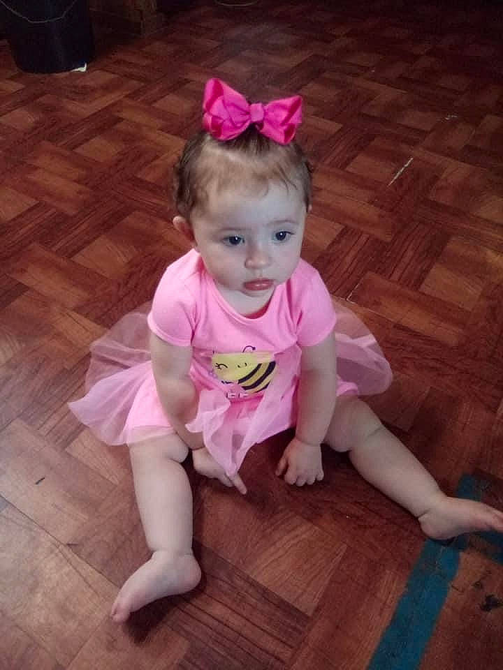 Athena is registered to the contest to win money with this photo: baby, baby_toddler_clothing, ballet_tutu, child, costume, dress, floor, flooring, fun, hair_accessory, person, pink, shoe, skin, smile, toddler