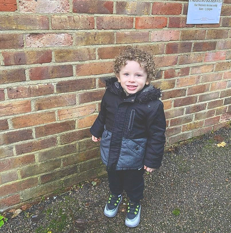 Luciano is registered to the contest to win money with this photo: asphalt, brick, brickwork, cobblestone, denim, flooring, grass, happy, head, jacket, joy, pattern, people_in_nature, person, road_surface, sidewalk, sitting, sleeve, soil, standing