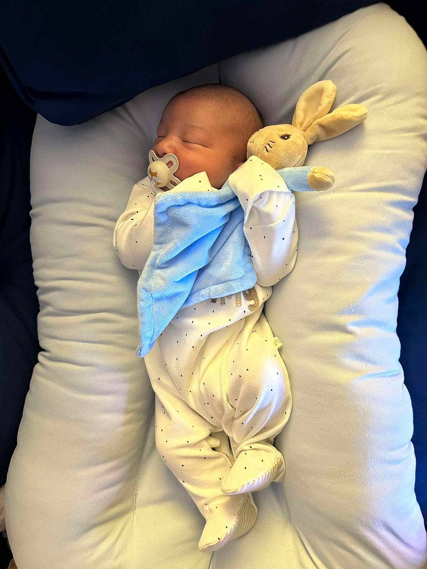 Teddy joined the competition — help win amazing prizes! newborn, baby, sleeping, pacifier, plush_toy, bunny, blanket, onesie, pillow, cushion, infant, cute, cozy, resting, soft, child, indoor, comfort, adorable, peaceful