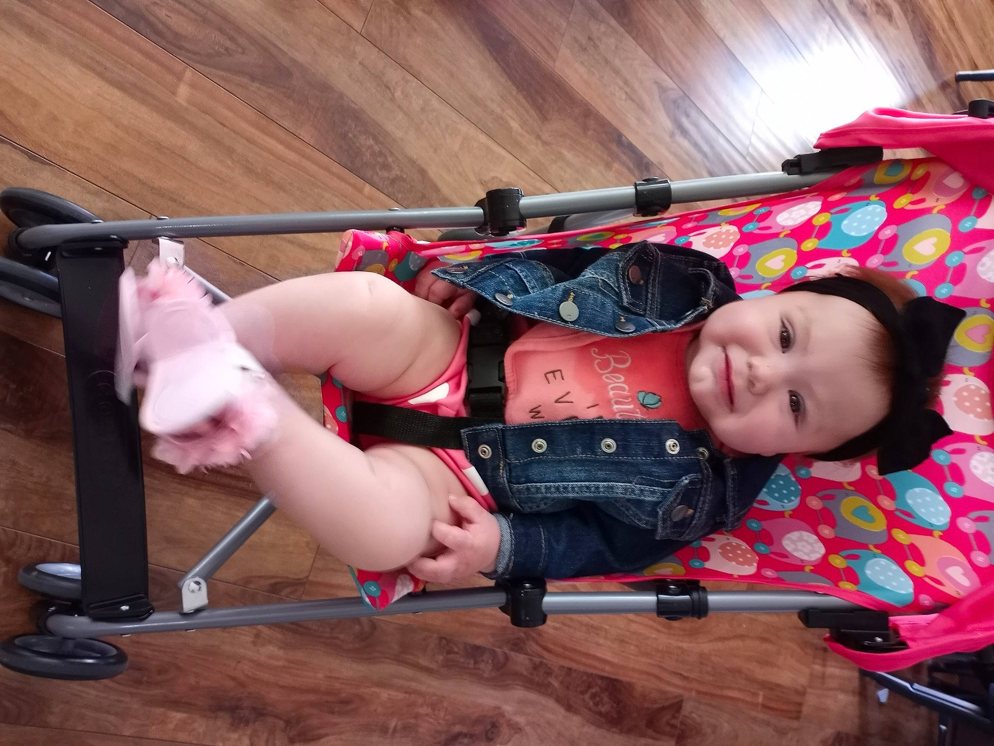 Octavia joined the competition — help win amazing prizes! baby, baby_carriage, baby_products, baby_toddler_clothing, chest, child, elbow, fun, human_leg, joy, knee, magenta, pattern, person, sandal, shorts, sitting, thigh, toddler, wood