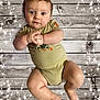 baby, infant, child, onesie, clothing, carhartt, wooden_background, sparkles, star_effects, floating, cute, portrait, skin, hands, legs, feet, blue_eyes, short_hair, expression, studio_effect