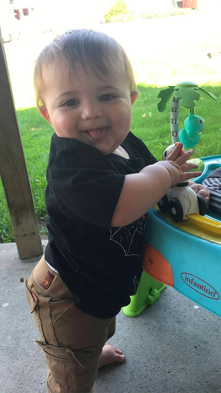 Michael is registered to the contest to win money with this photo: baby, child, grass, joy, person, plant, play, product, smile, toddler, toy, tree