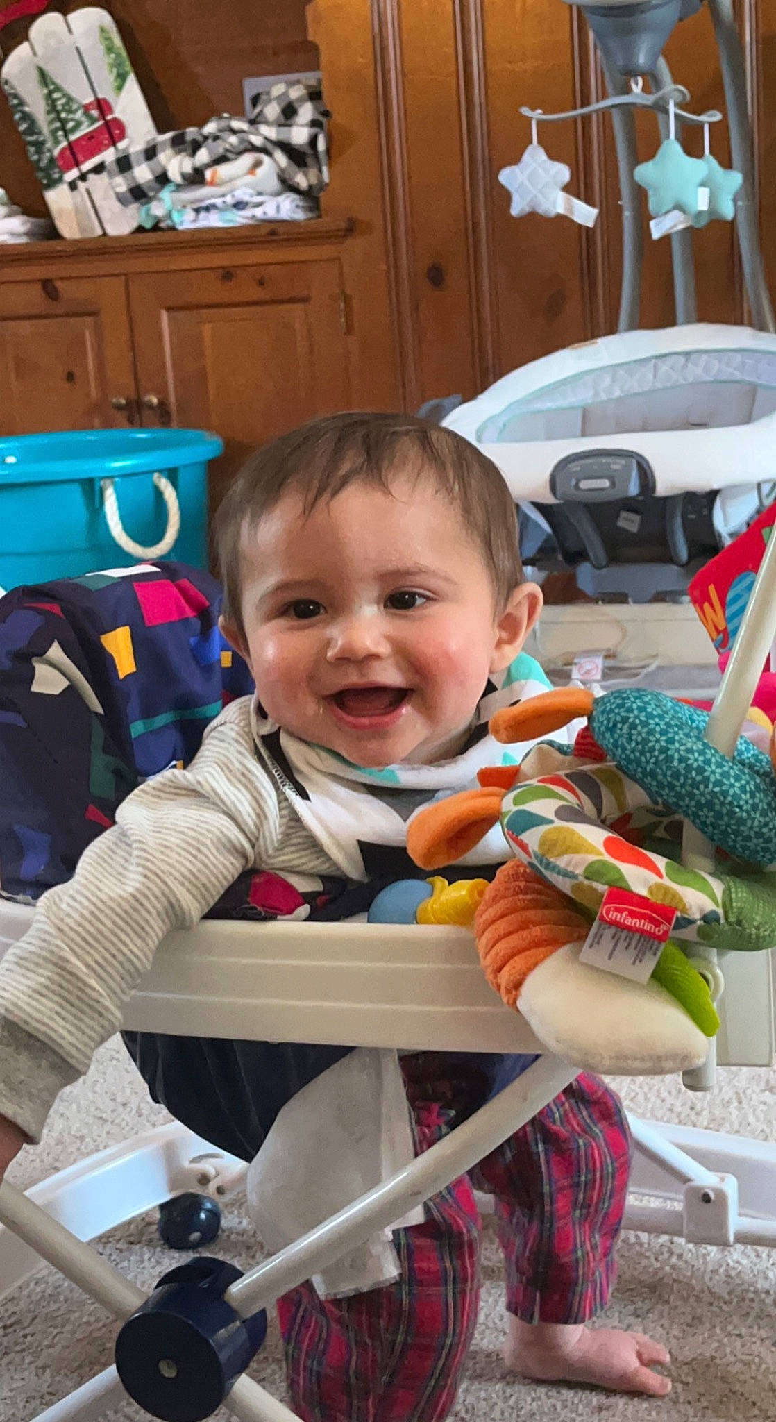 Tucker is registered to the contest to win money with this photo: baby, baby_carriage, baby_products, baby_toddler_clothing, cabinetry, cheek, child, facial_expression, fun, happy, joy, person, play, product, room, sitting, smile, standing, toddler, toy