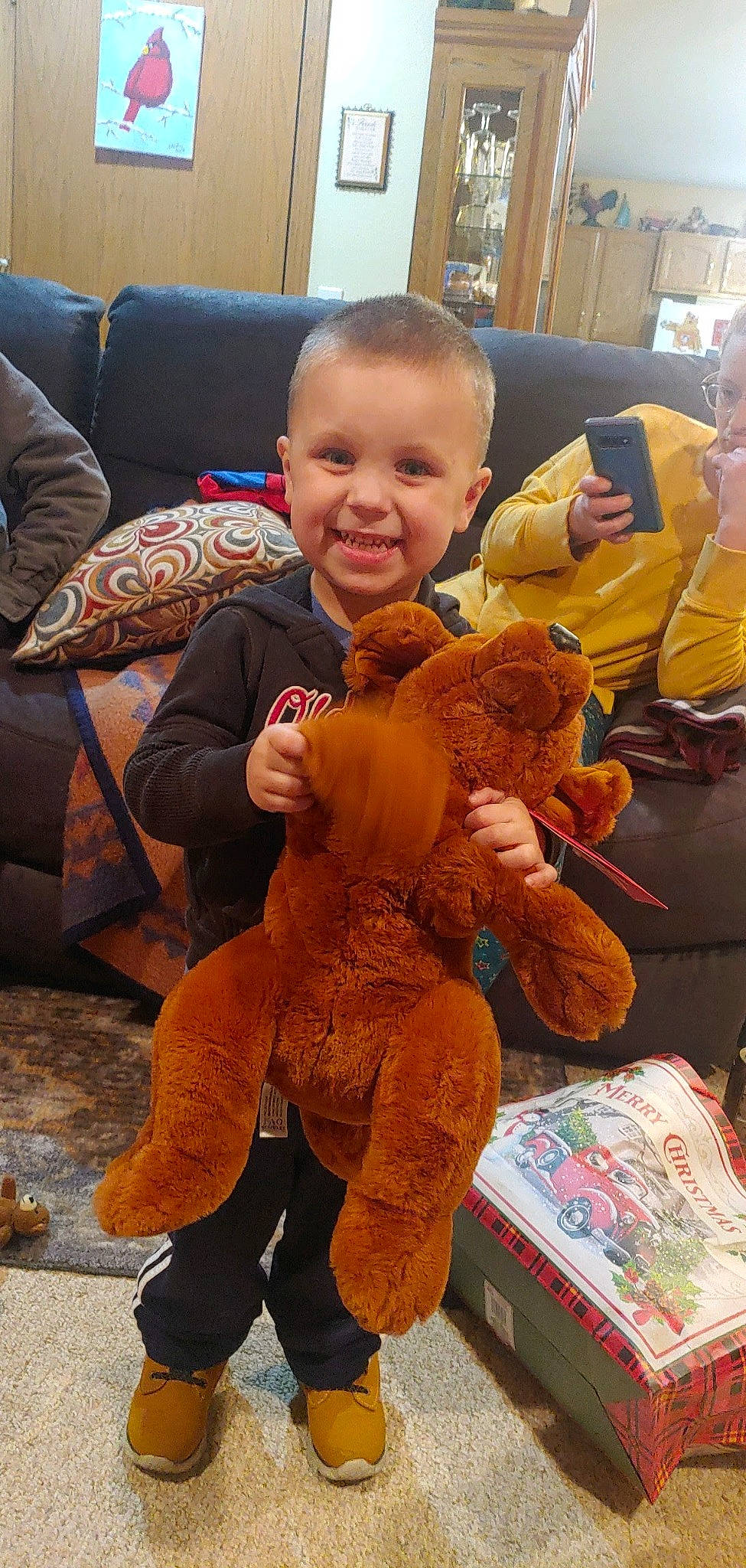 Levi is registered to the contest to win money with this photo: child, comfort, couch, fun, fur, joy, lap, mammal, orange, people, person, photograph, plush, room, smile, snapshot, stuffed_toy, teddy_bear, textile, toddler