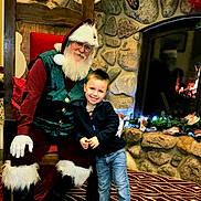 Levi joined the competition — help win amazing prizes! adult, boy, child, christmas, clothing, coat, face, festival, fireplace, footwear, glove, head, indoors, jeans, male, man, pants, person, santaclaus, shoe