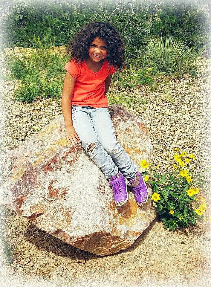 Heaveneiya is registered to the contest to win money with this photo: beauty, child, footwear, fun, grass, happy, joy, long_hair, person, photography, plant, play, shoe, sitting, smile, summer, tree, vacation, wildflower