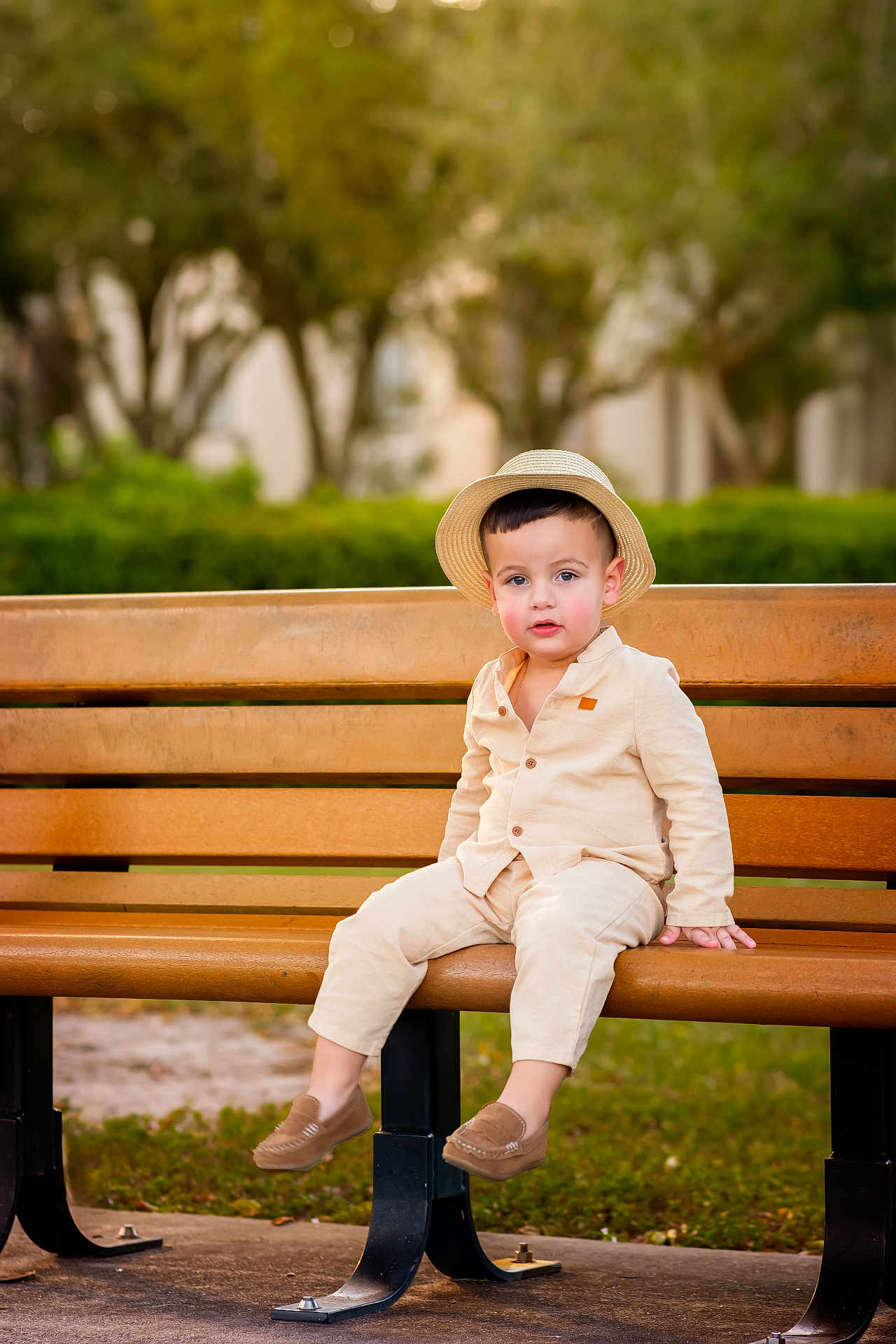 Dylan Michel joined the competition — help win amazing prizes! background_blur, bench, casual_clothing, child, curious, cute, daylight, face, greenery, hat, nature, outdoor, park, person, portrait, shoes, sitting, toddler, wood, young_child