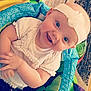 Nevayah joined the competition — help win amazing prizes! baby, child, smiling, headband, white_clothing, play_mat, indoor, infant, happy, cute, portrait, young_child, sitting, colorful, toy, face, arms, closeup, head, expression