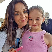 Kinsley is registered to the contest to win money with this photo: woman, girl, child, smiling, selfie, summer, pink_tank_top, strawberry_emblem, popsicle, kinder_surprise, outdoor, happy, portrait, casual_clothing, earrings, long_hair, light_skin, daylight, closeup, family