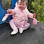 Kinsley joined the competition — help win amazing prizes! toddler, child, pink_jacket, mittens, trampoline, smiling, outdoor, floral_skirt, white_shoes, happy, grass, greenery, play, cute, young_child, sitting, nature, fun, joyful, baby