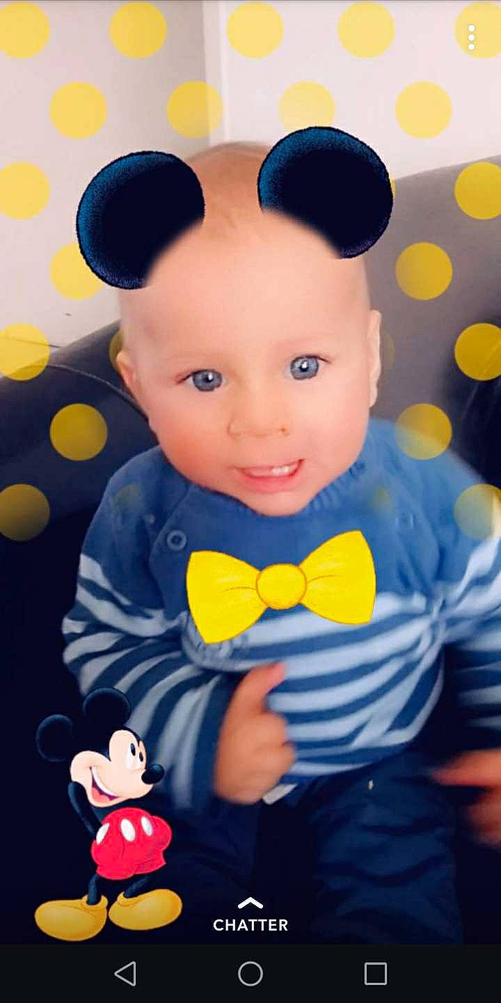 Yanis a rejoint le concours — aidez-le/la à gagner de superbes lots ! baby, baby_toddler_clothing, child, ear, happy, outerwear, pattern, person, smile, toddler, toy, yellow