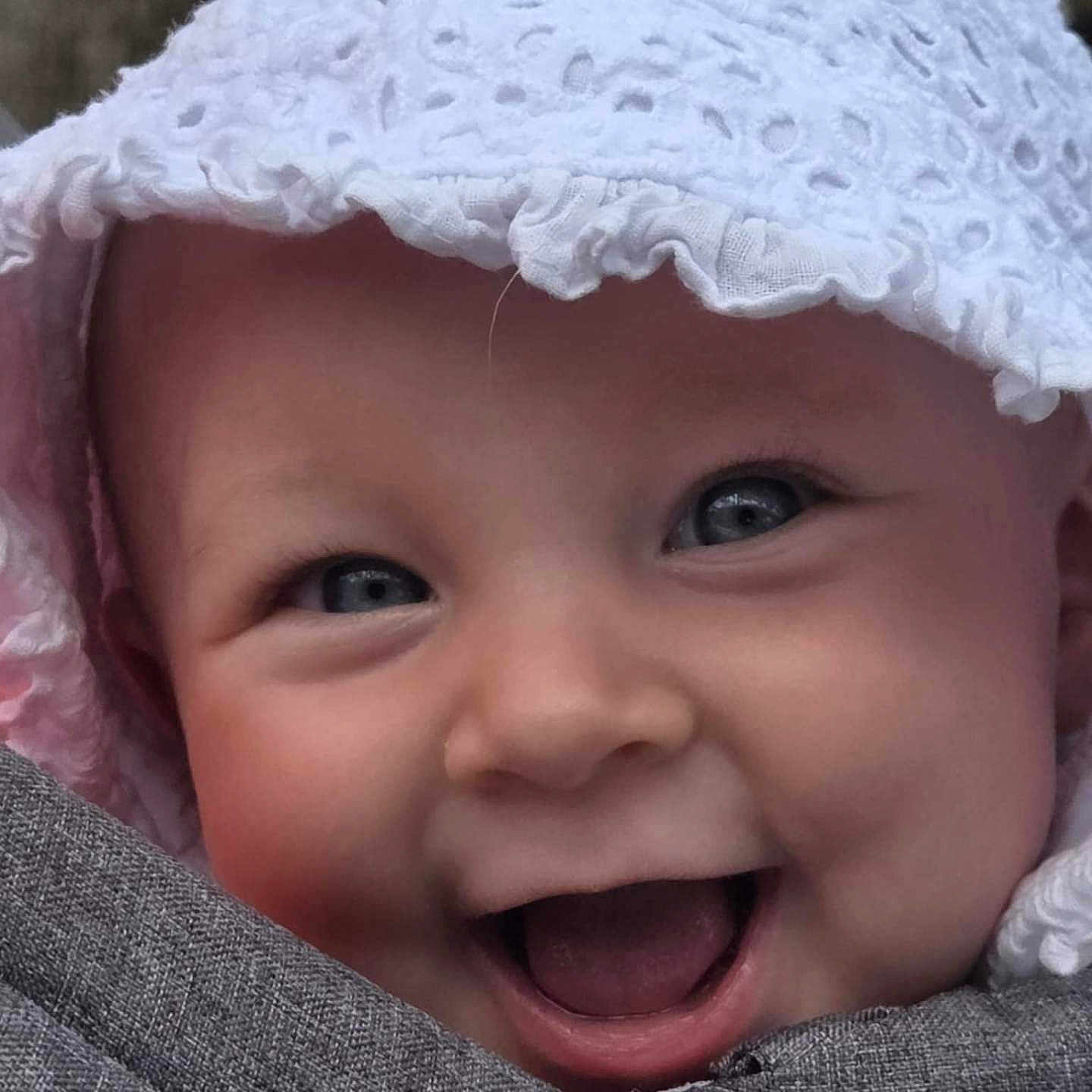 Lilly is registered to the contest to win money with this photo: baby, babylaughing, bonnet, cap, clothing, coat, face, happy, hat, head, hood, jacket, laughing, person, photography, portrait, smile, sunhat