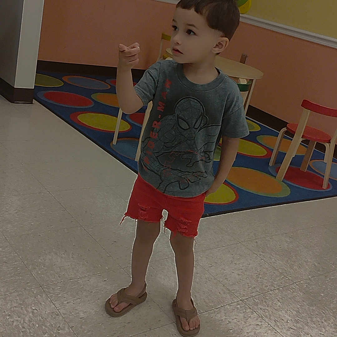 Braxley Geovanni joined the competition — help win amazing prizes! barefoot, bodypart, boy, chair, child, clothing, face, finger, footwear, furniture, head, longsleeve, male, pants, person, sandal, shoe, shorts, sleeve, t_shirt