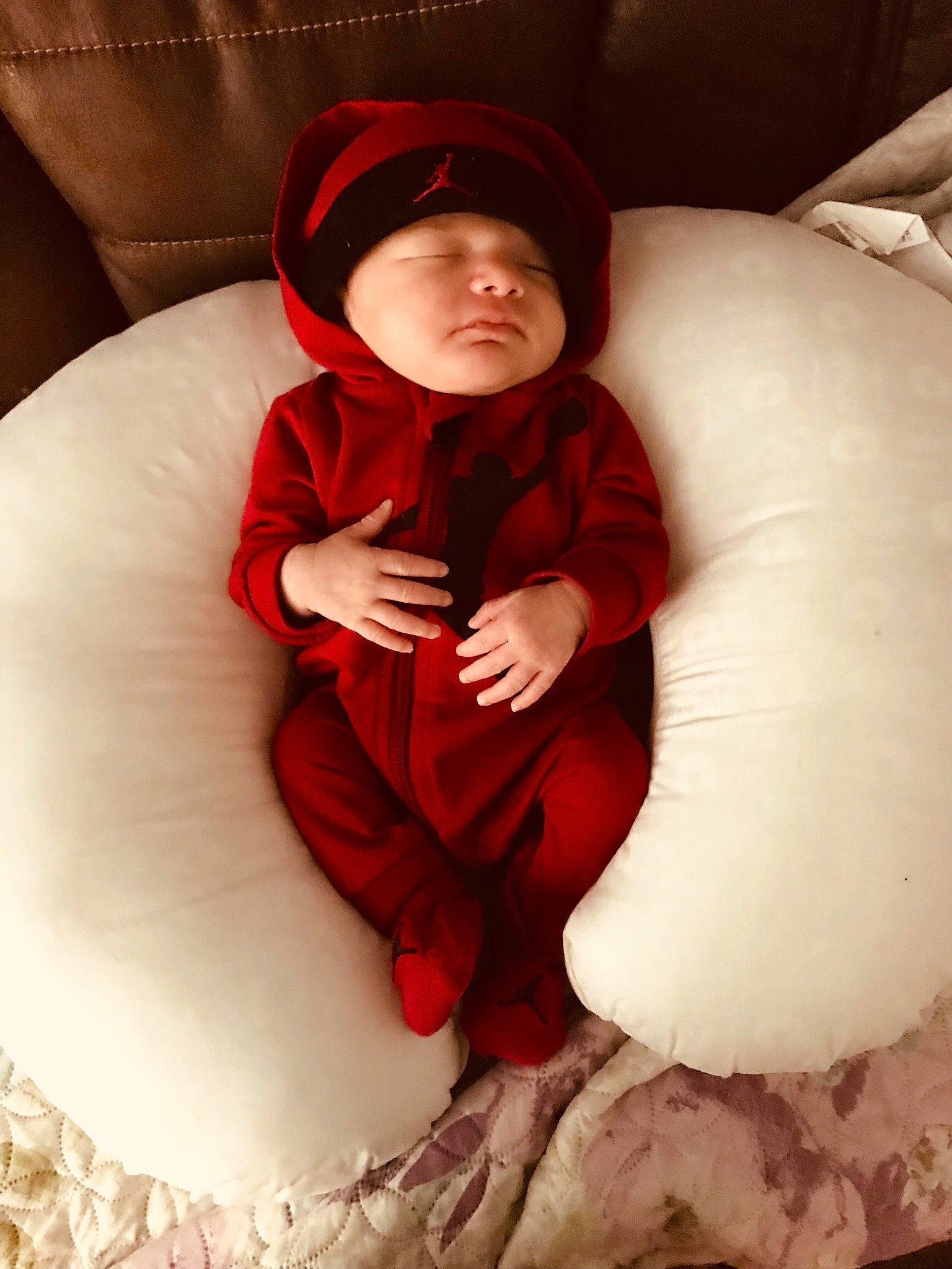 Braxley Geovanni is registered to the contest to win money with this photo: arm, baby, baby_toddler_clothing, cap, comfort, eye, face, finger, flash_photography, fun, hand, head, headgear, headwear, human_body, mouth, person, sitting, sleeve, textile
