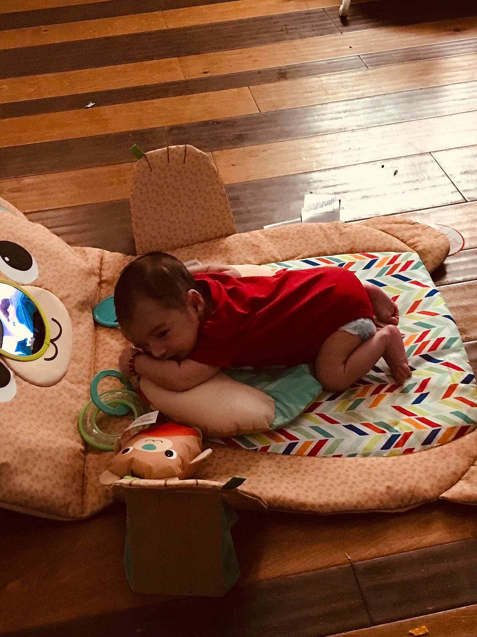 Braxley Geovanni is registered to the contest to win money with this photo: baby, barefoot, child, comfort, floor, flooring, foot, fun, hardwood, human_leg, leisure, living_room, pattern, person, play, room, sitting, t_shirt, toddler, wood