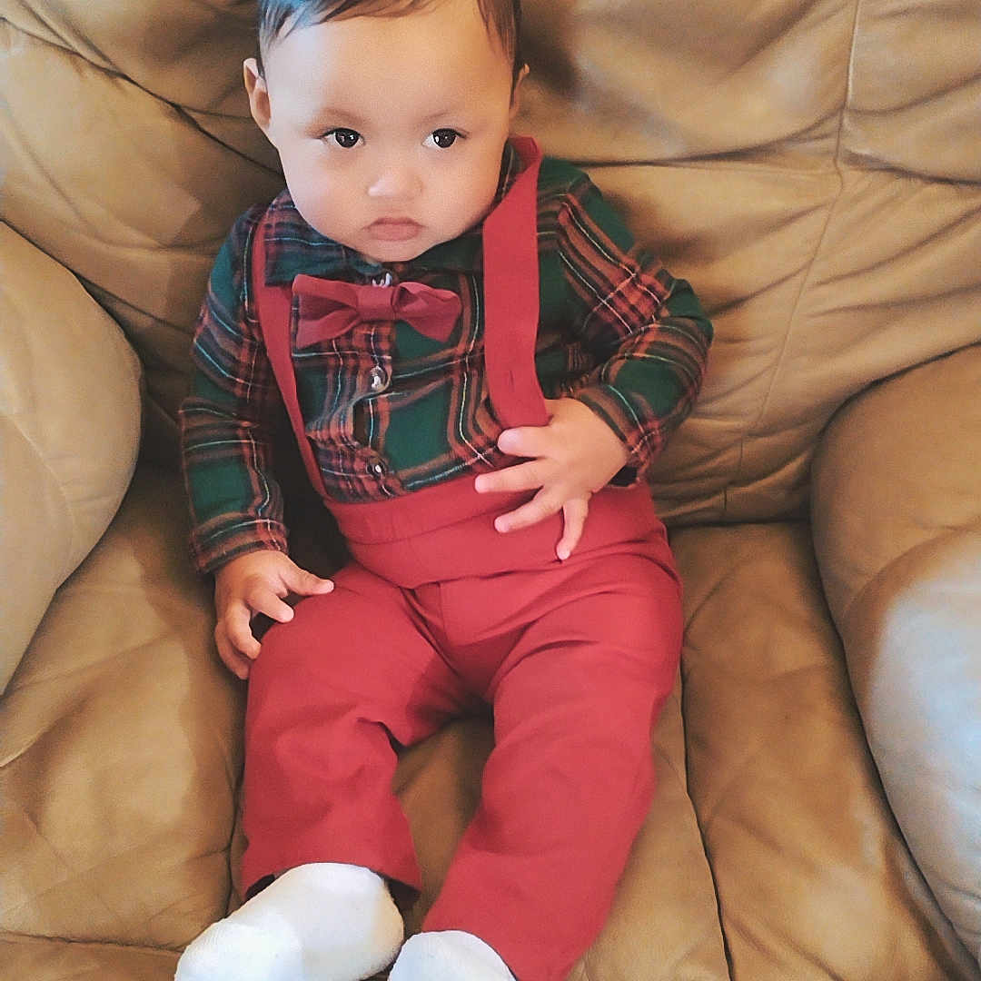 Jhael is registered to the contest to win money with this photo: accessories, baby, bodypart, chair, clothing, couch, cushion, face, finger, furniture, hand, head, homedecor, hosiery, pants, person, photography, portrait, sitting, sock