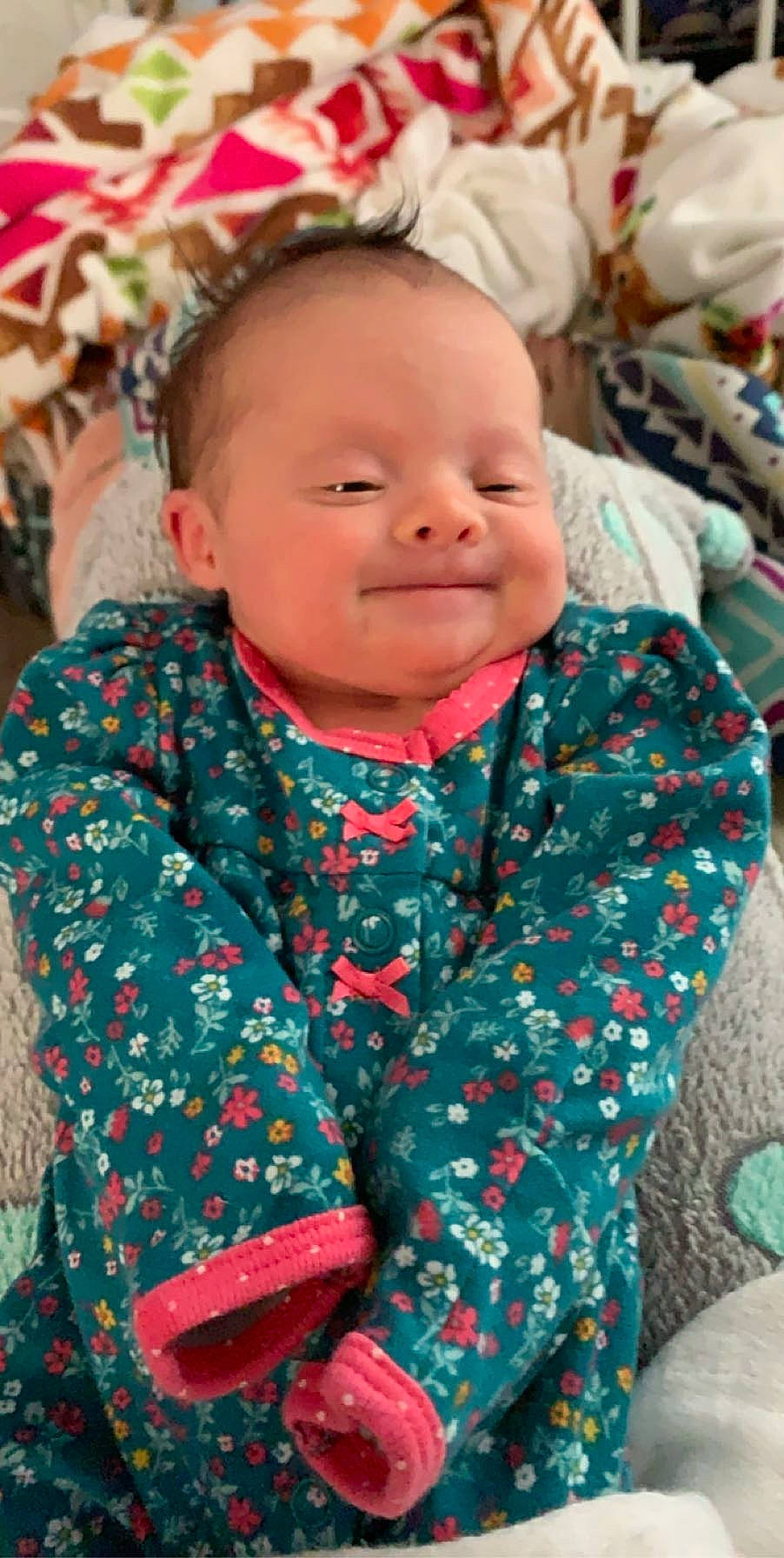 Poppy is registered to the contest to win money with this photo: baby, cheek, child, face, head, joy, outerwear, person, skin, smile, toddler