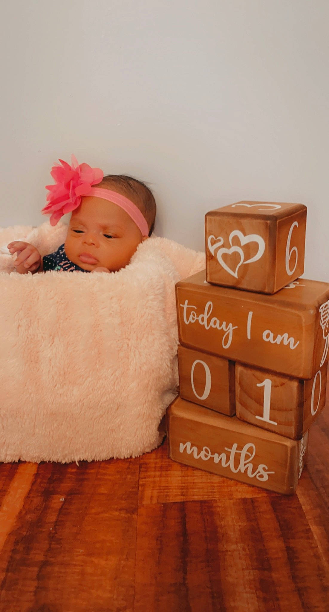 Janiya joined the competition — help win amazing prizes! baby, baby_toddler_clothing, box, carton, comfort, fashion_accessory, flooring, font, hair_accessory, happy, hardwood, headband, headpiece, headwear, packaging_and_labeling, packing_materials, peach, person, product, shipping_box