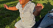 Karmelo is registered to the contest to win money with this photo: toddler, child, baby, grass, park, outdoor, sunlight, hat, striped_clothing, stroller, wheel, happy, laughing, cute, nature, greenery, trees, summer, playful, person