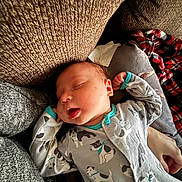 Griffin joined the competition — help win amazing prizes! baby, sleeping, onesie, dog_pattern, tongue_out, couch, blanket, cozy, infant, relaxing, indoor, cute, face, hand, soft_lighting, texture, rest, peaceful, child, portrait