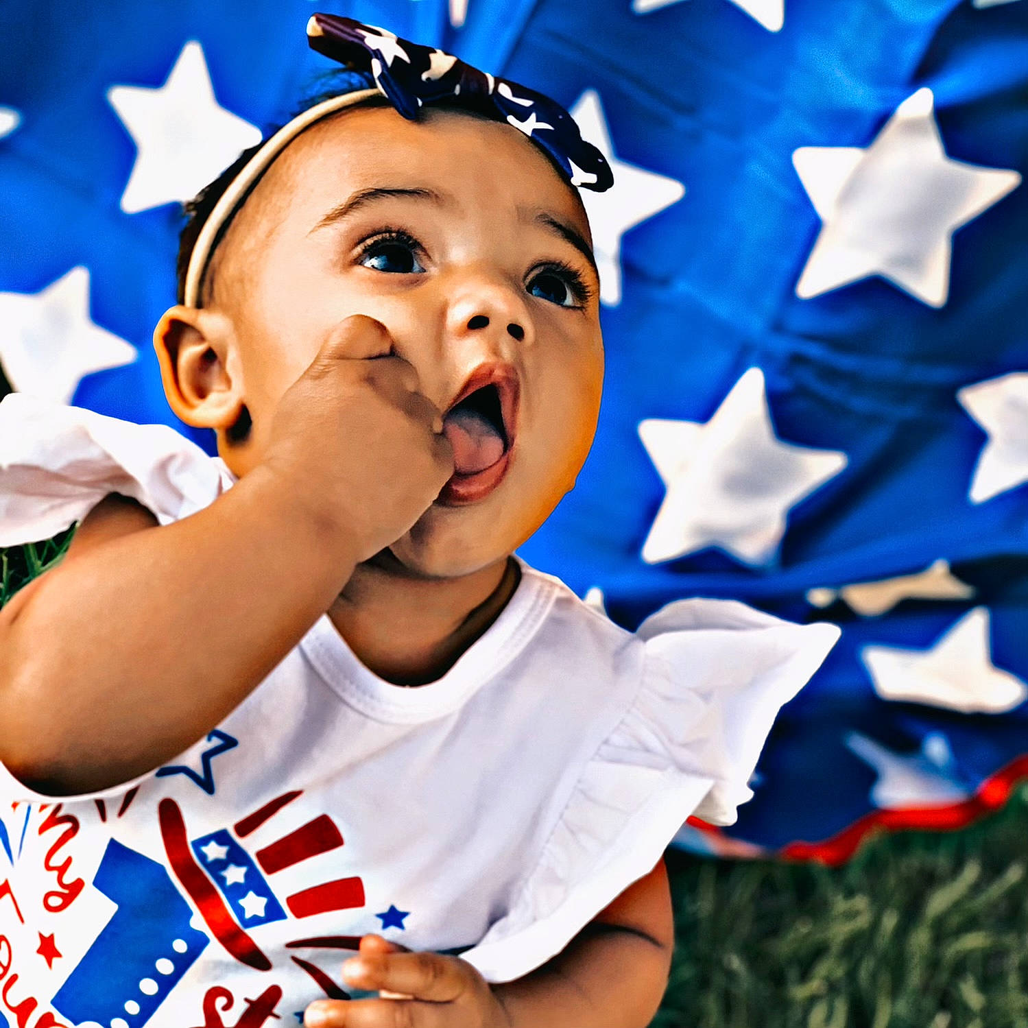Tessah is registered to the contest to win money with this photo: baby, baby_toddler_clothing, blue, child, electric_blue, event, fictional_character, finger, flag_day_usa, flag_of_the_united_states, fun, gesture, happy, holiday, pattern, people_in_nature, person, sleeve, t_shirt, thumb