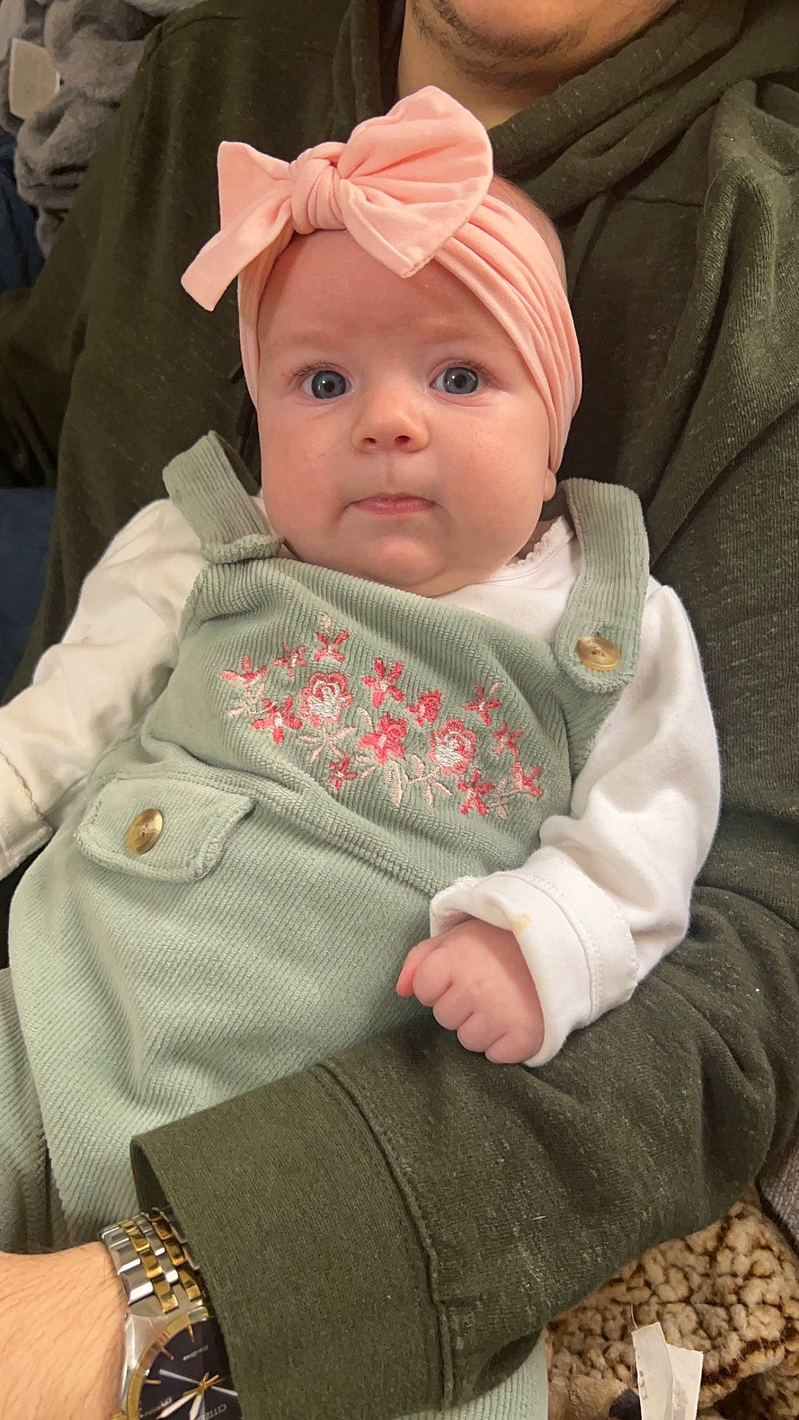 Isla is registered to the contest to win money with this photo: baby, baby_products, baby_safety, baby_toddler_clothing, cheek, child, comfort, grass, headwear, linens, person, sitting, skin, sleeve, toddler