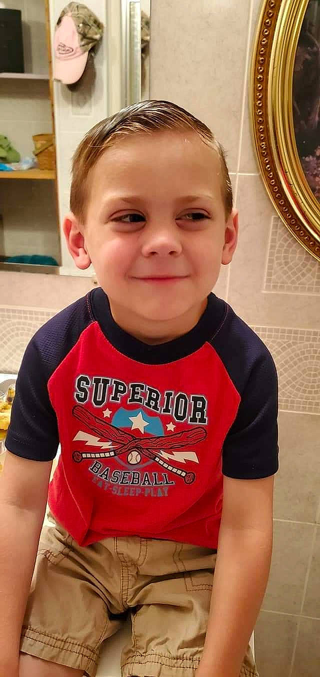 Ender is registered to the contest to win money with this photo: active_shirt, baby_toddler_clothing, belt, caesar_cut, cheek, crew_cut, ear, eyebrow, forehead, hair_accessory, houseplant, iris, joy, khaki, person, picture_frame, shelf, shelving, sleeve, temple