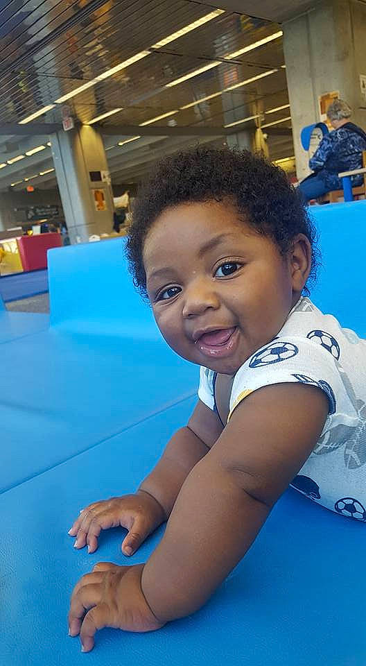 Clinton is registered to the contest to win money with this photo: arm, beauty, blue, boy, child, day, facial_expression, fun, girl, human_body, indoor_games_and_sports, leg, leisure, person, physical_fitness, play, smile, sport_venue, trunk, youth